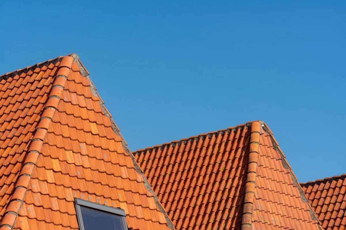 Clay barrel tile rooflines on homes in Tyler, TX