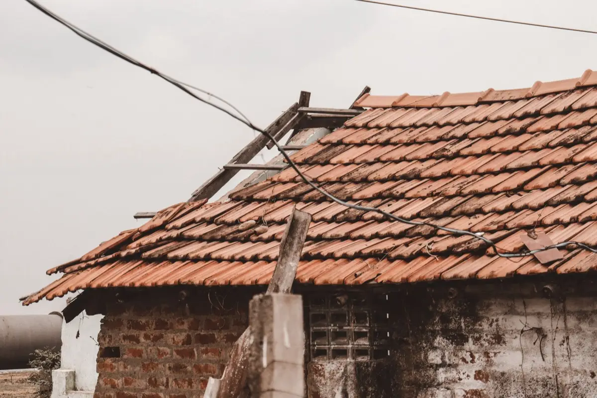 Roof damaged by a windstorm in Tyler, TX