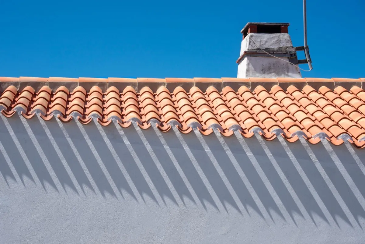 Roof ridge line and chimney on a home in Tyler, TX